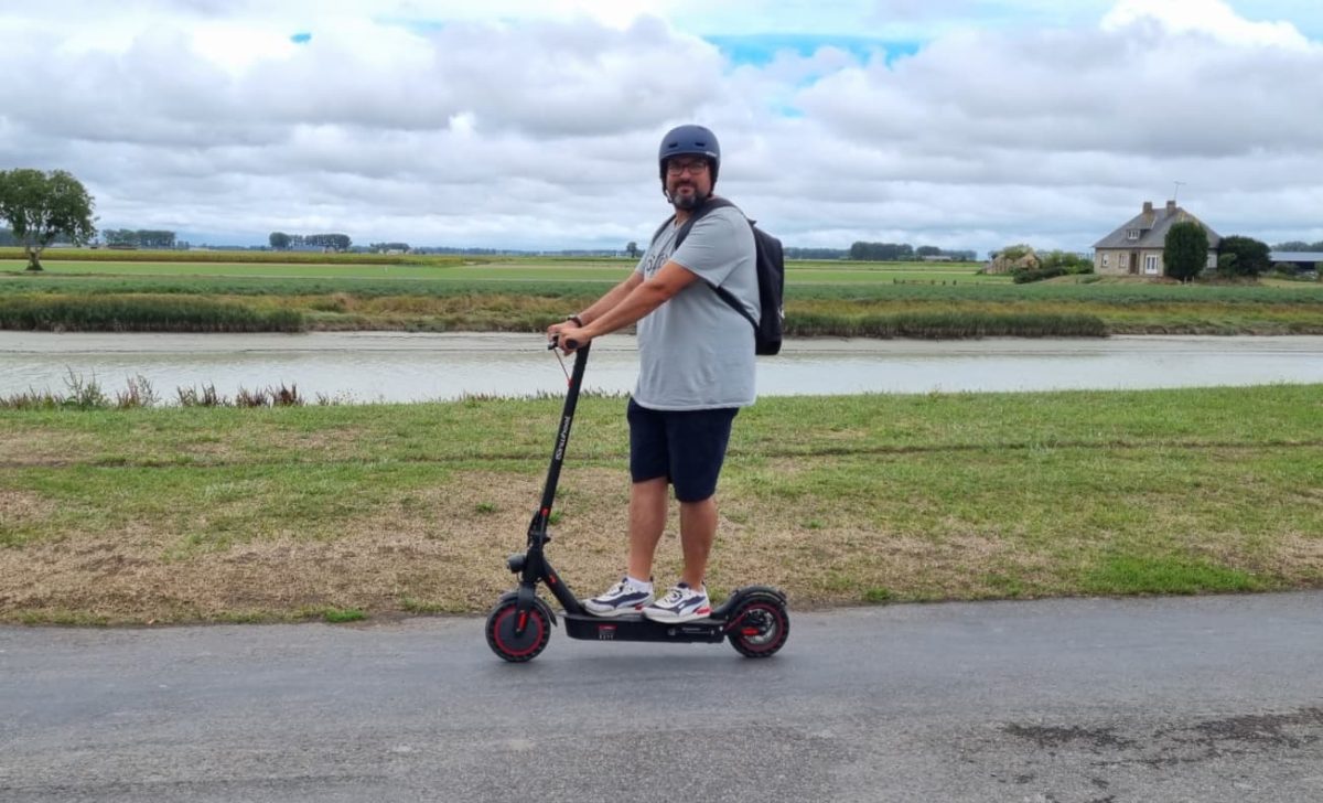 person riding on isinwheel scooter